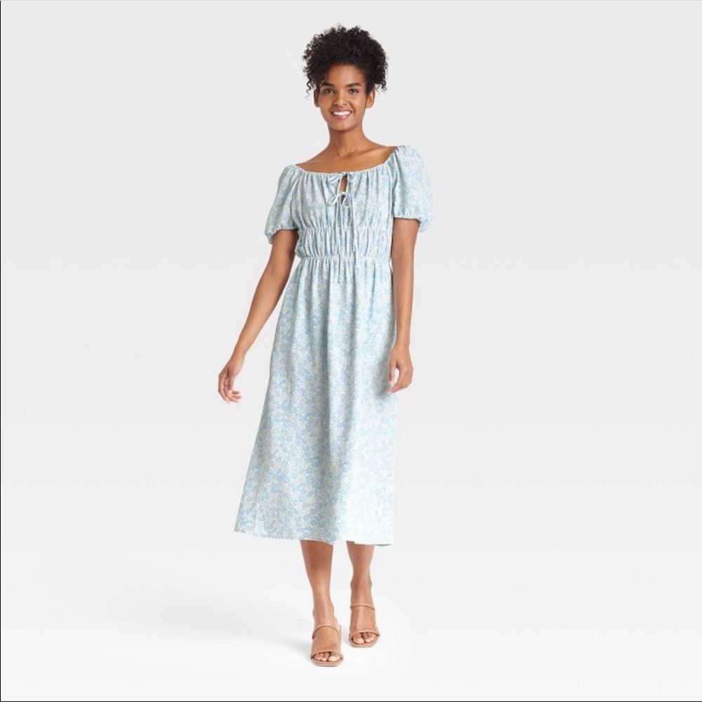 Woman’s puff short Sleeved smocked dress